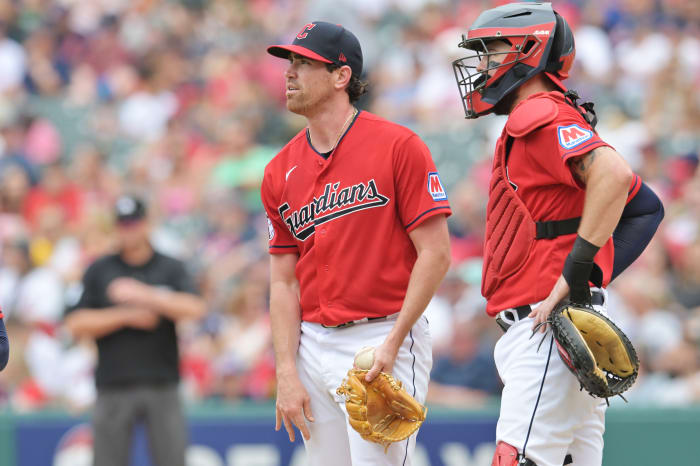 Jul 9, 2023; Cleveland, Ohio, USA; Cleveland Guardians starting pitcher Shane Bieber (57) and catcher Cam Gallagher (35) look to the scoreboard during the sixth inning against the Kansas City Royals at Progressive Field. Mandatory Credit: Ken Blaze-USA TODAY Sports